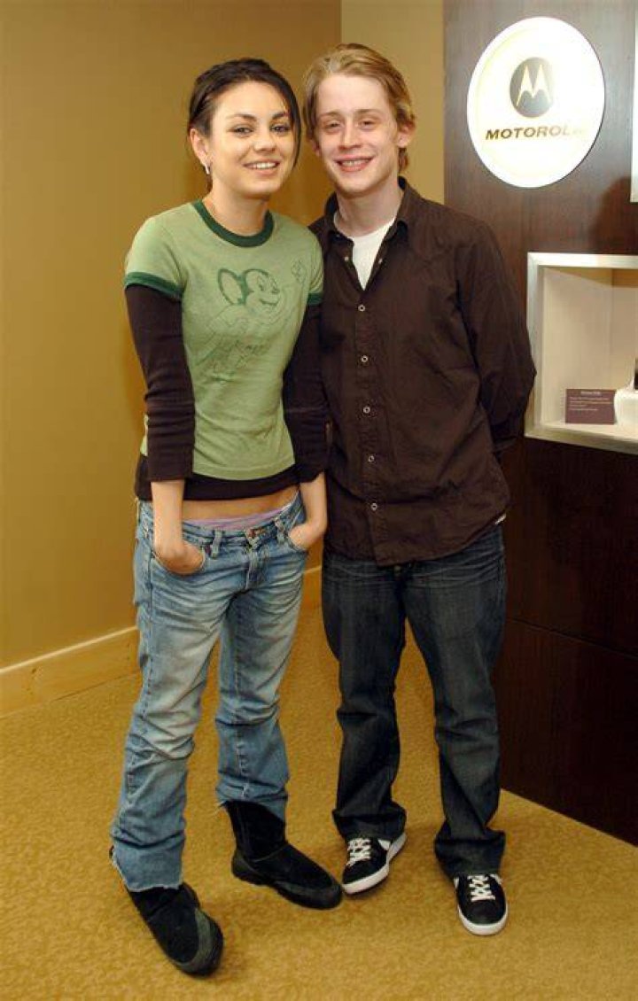 Macaulay Culkin and Mila Kunis at the Launch Celebrity Auction to Benefit Hurricane Victims in 2005 | Source: Getty Images