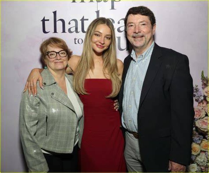 Madelyn Cline with her parents.