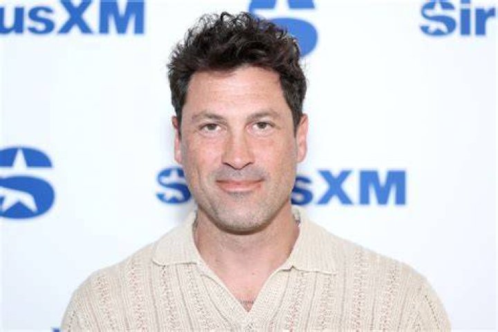Maksim Chmerkovskiy visits "Extra" at their New York studios at H&M in Times Square | Getty Images