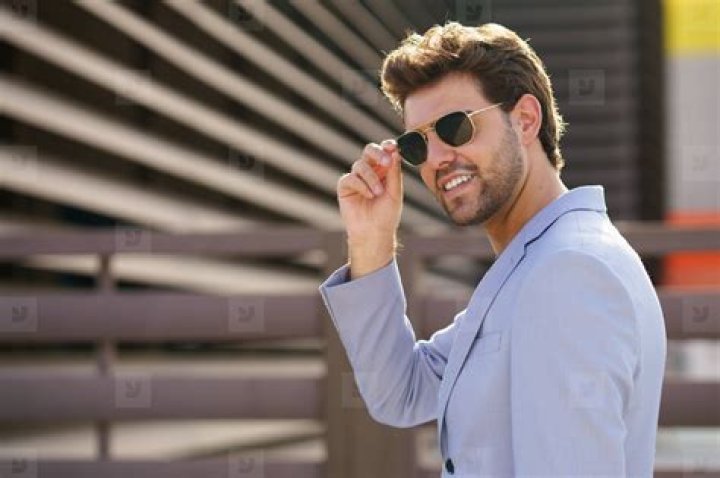 Man wearing sunglasses and a white shirt | Source: Unsplash / Mahdi Bafande