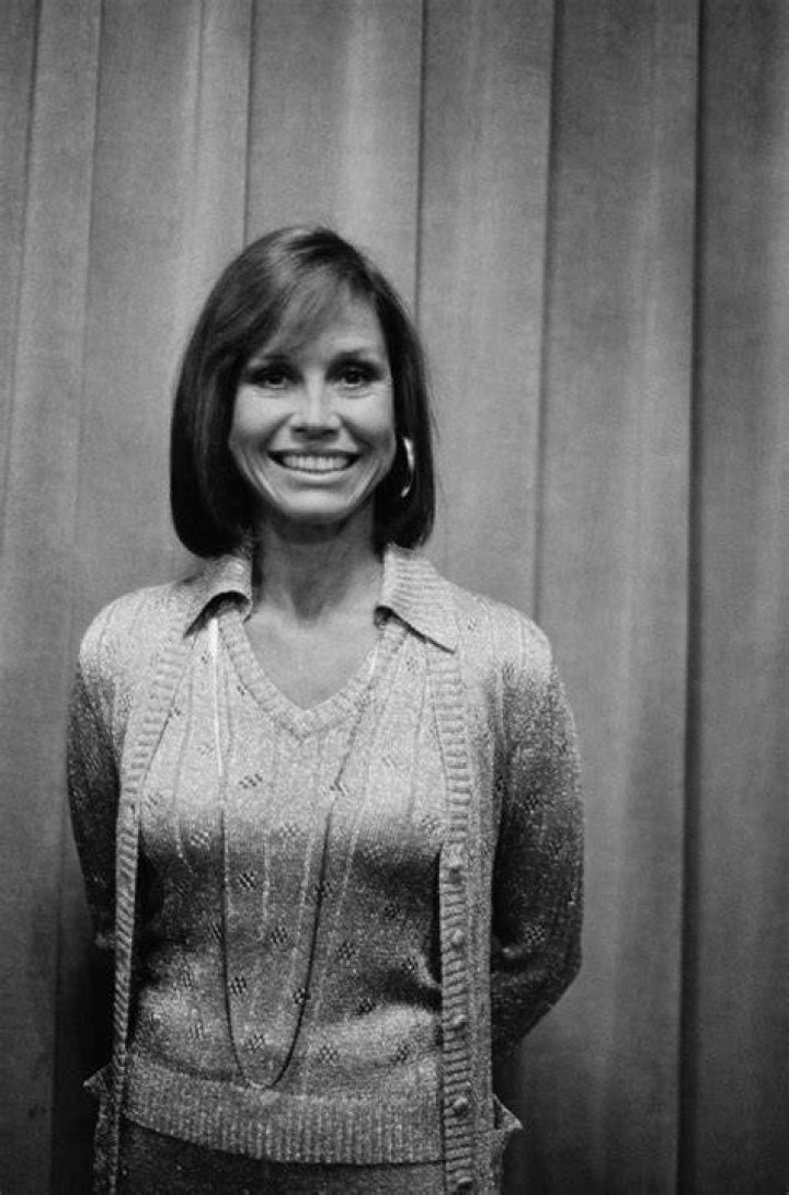 Mary Tyler Moore is pictured wearing a pink evening dress in a full-length publicity still, circa 1965. | Source: Getty Images
