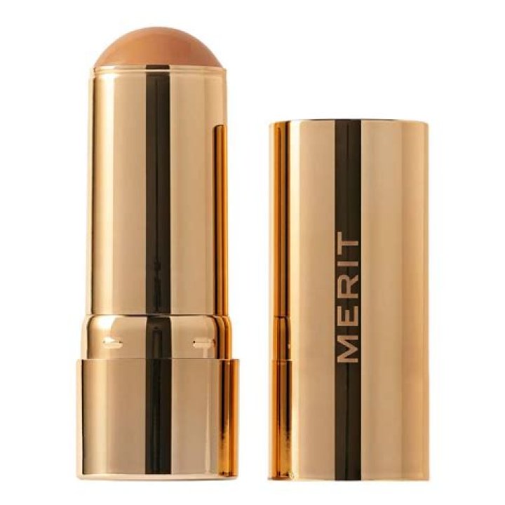Merit Beauty bronze balm on the left and the author wearing it on her face on the right