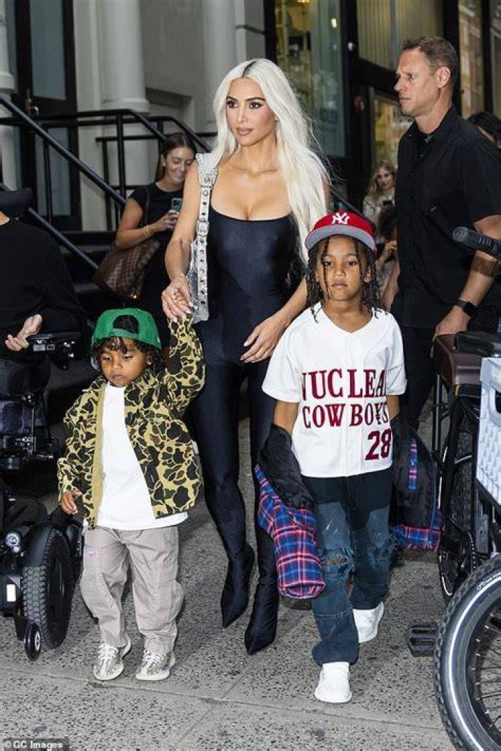 Momager: Meanwhile Kim signed Saint's contract on his behalf due to his younger age; seen with Saint and younger son Psalm, four, in 2022