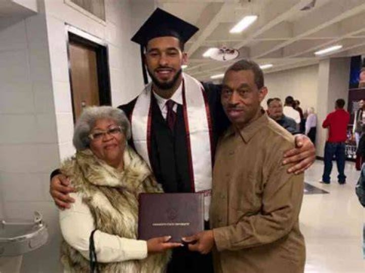 Montez with his grandparents Charles and Deborah during his graduation from Mississippi State University.
