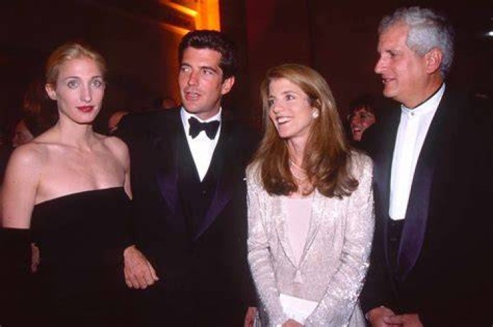 Newlyweds John F. Kennedy Jr. and Carolyn Bessette Kennedy standing in front of their apartment in Tribecca. / Source: Getty Images