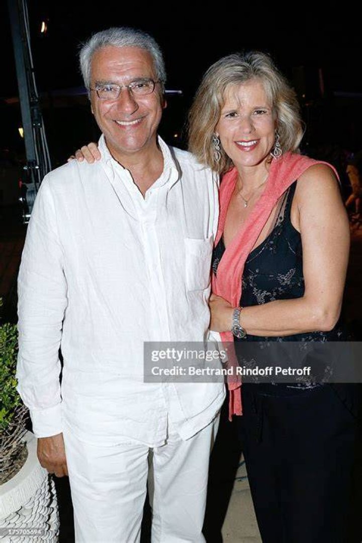 Norbert Balit and his companion Laurence Piquet at President of the Union of Showmen Marcel Campion's party at La Bouillabaisse beach on August 6, 2013 in Saint-Tropez, France | Source: Getty Images