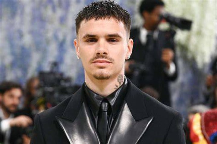 Outfits: Romeo Beckham's girlfriend Mia Regan shared a snap of the couple's rehearsal dinner outfits, as she donned a yellow dress while Romeo wore a pink suit