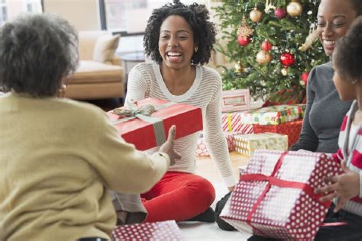 People exchange Christmas gifts | Source: Shutterstock