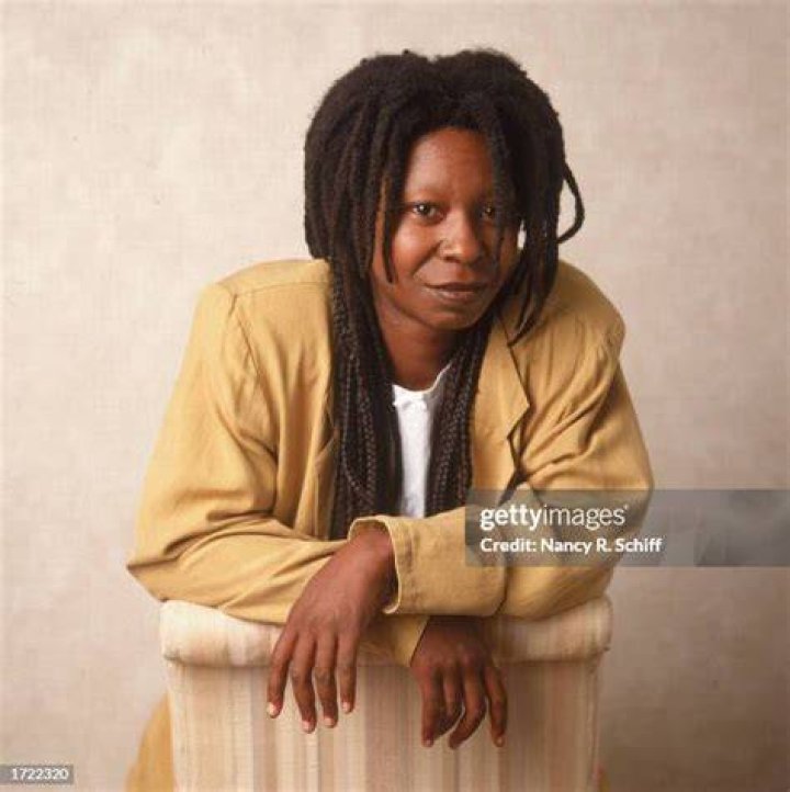 Portrait of Whoopi Goldberg leaning on a chair, 1988. | Source: Getty Images