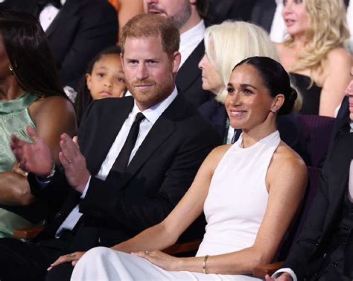 Prince Harry and Meghan shared an intimate on-stage kiss at the opening ceremony of the Invictus Games in the Zuiderpark stadium in The Hague, the Netherlands