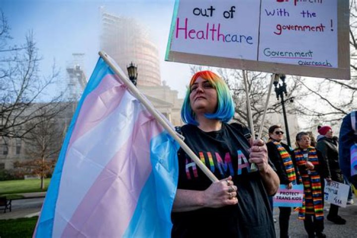 Protestors in support of transgender rights rally outside the Alabama State House in Montgomery, Ala., on Tuesday, March 30, 2021.