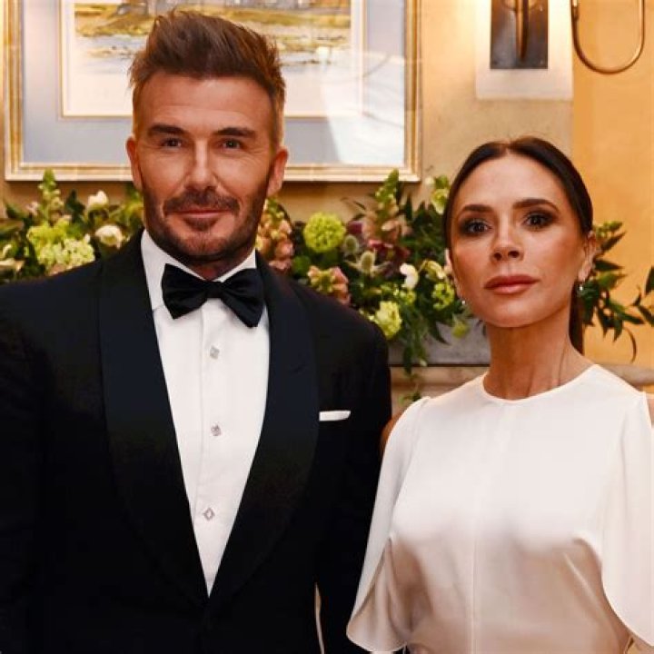 Proud: Victoria and David Beckham put on a smitten display as they arrived at their eldest son's wedding holding hands