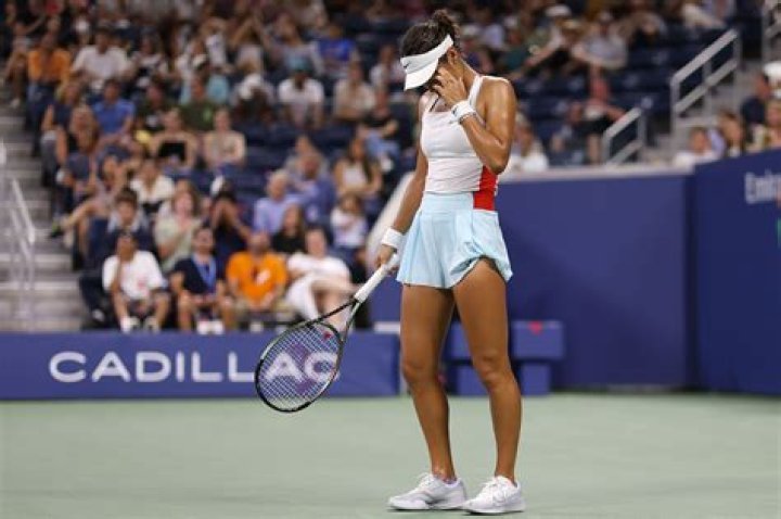 Raducanu's mother and father pictured bottom left and top right as their daughter quit the British grand slam
