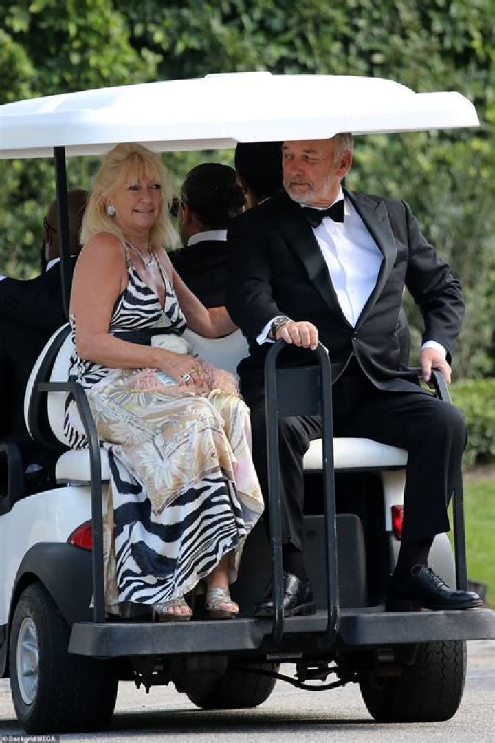 Riding: Ted and Hilary, who stunned in a striped dress and silver heels, travelled in a golf buggy as they made their way across the sprawling estate