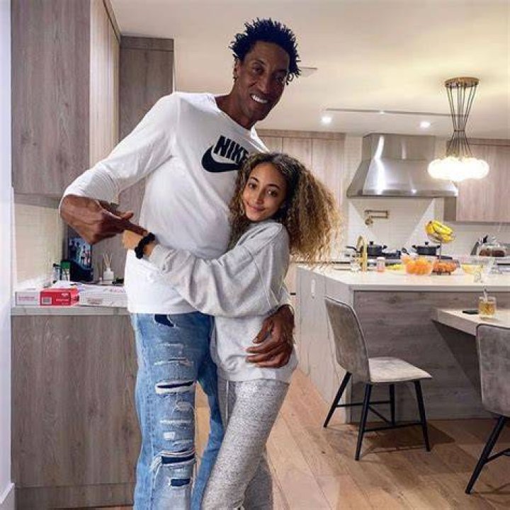 Scottie posing with his daughter and three sons