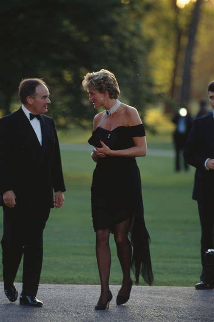 She wore a black cocktail dress, stockings and a Happy Birthday headpiece