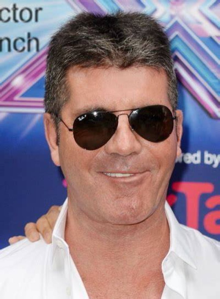 Simon Cowell accident X Factor judge in hospital after breaking his back falling off an