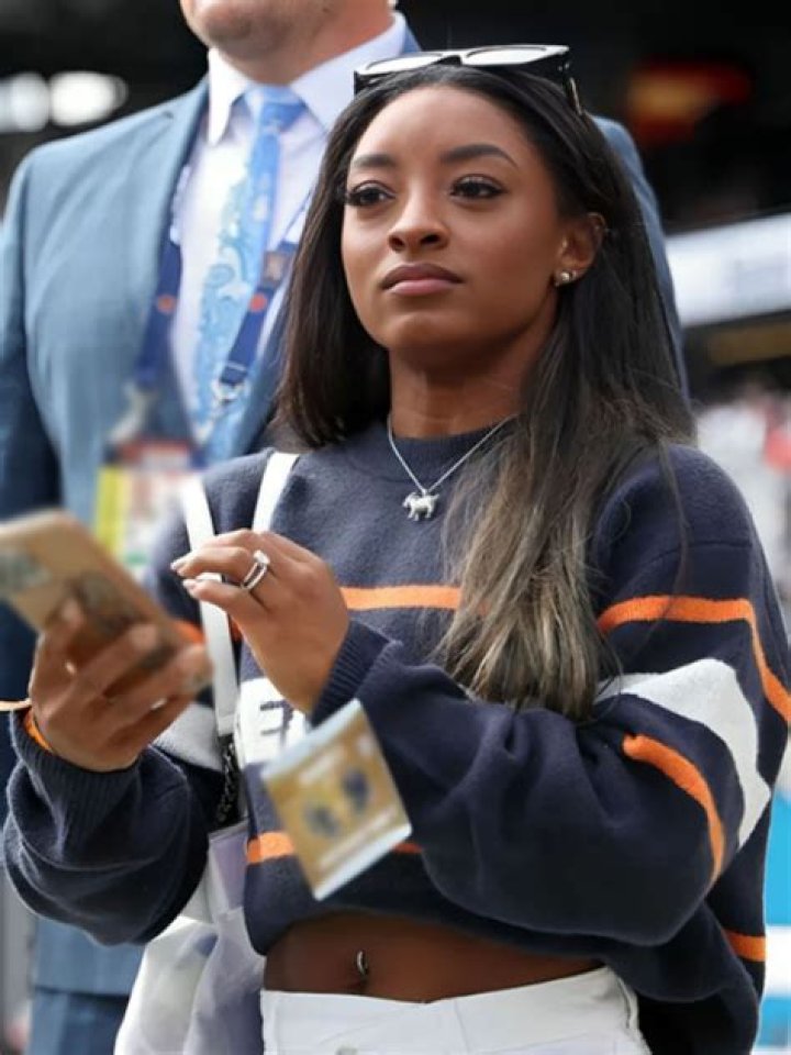 Simone Biles wearing a sweater that says "OWENS" which she posted on her Instagram Story. | Photo: