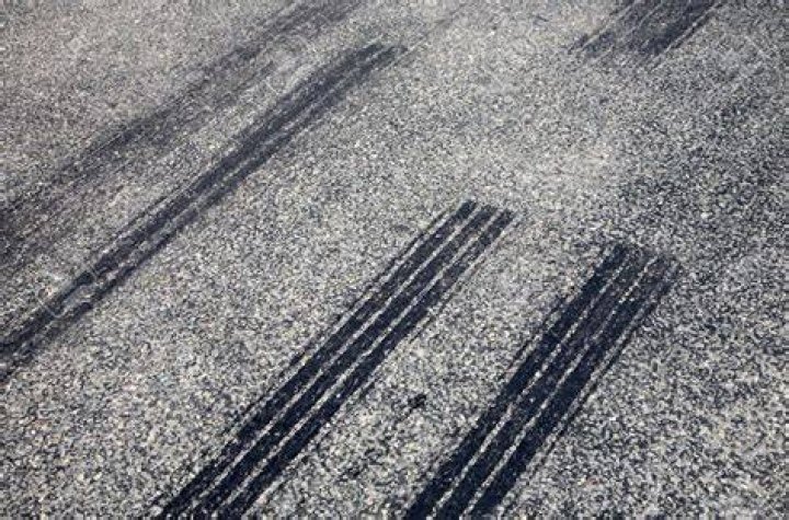 Skid marks are seen on the ground at the intersection as investigators on Thursday evening tried to work out what had happened