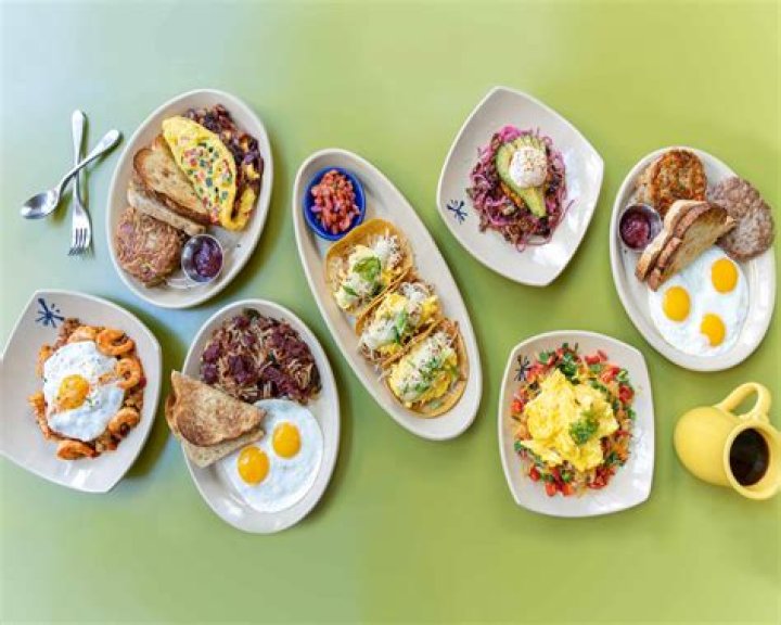 snooze, an am eatery burrata and prosciutto toast with eggs