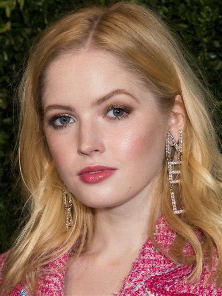 Snow white: Actress Ellie Bamber wore a white satin ensemble