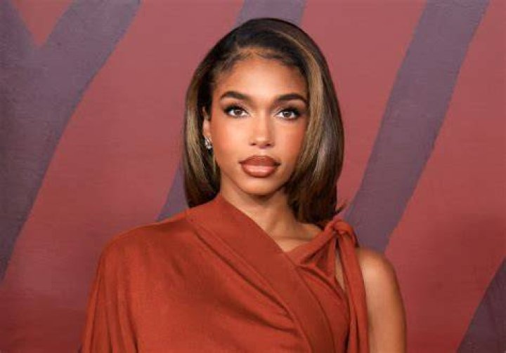 Steve Harvey's Daughter Lori Looks Alluring in IG Snaps Posing in a Form-Fitting Denim Dress