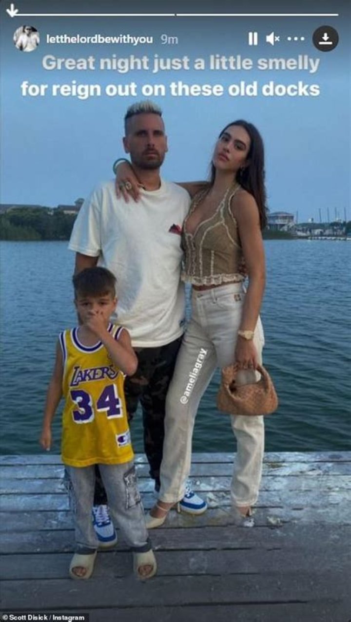 Summer holiday: Scott Disick, 38, and girlfriend Amelia Hamlin, 20, enjoyed a moment by a 'smelly' dock with the reality star's son Reign, six, during their vacation in The Hamptons on Friday
