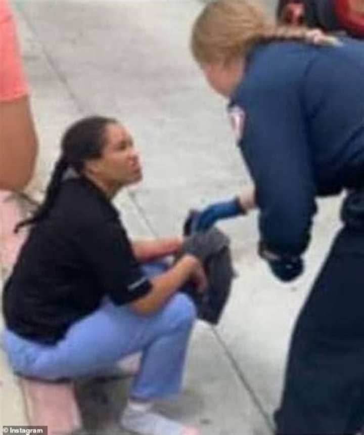 Tabia Johnson, a witness to the crash, took a photo of the suspect, Nicole L. Linton (center), commenting that Linton only appeared to suffer minor injuries in the horrible crash