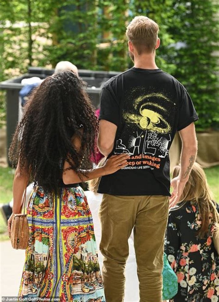 Tactile: Calvin and Vick looked close attending the Chelsea Flower Show together on Monday