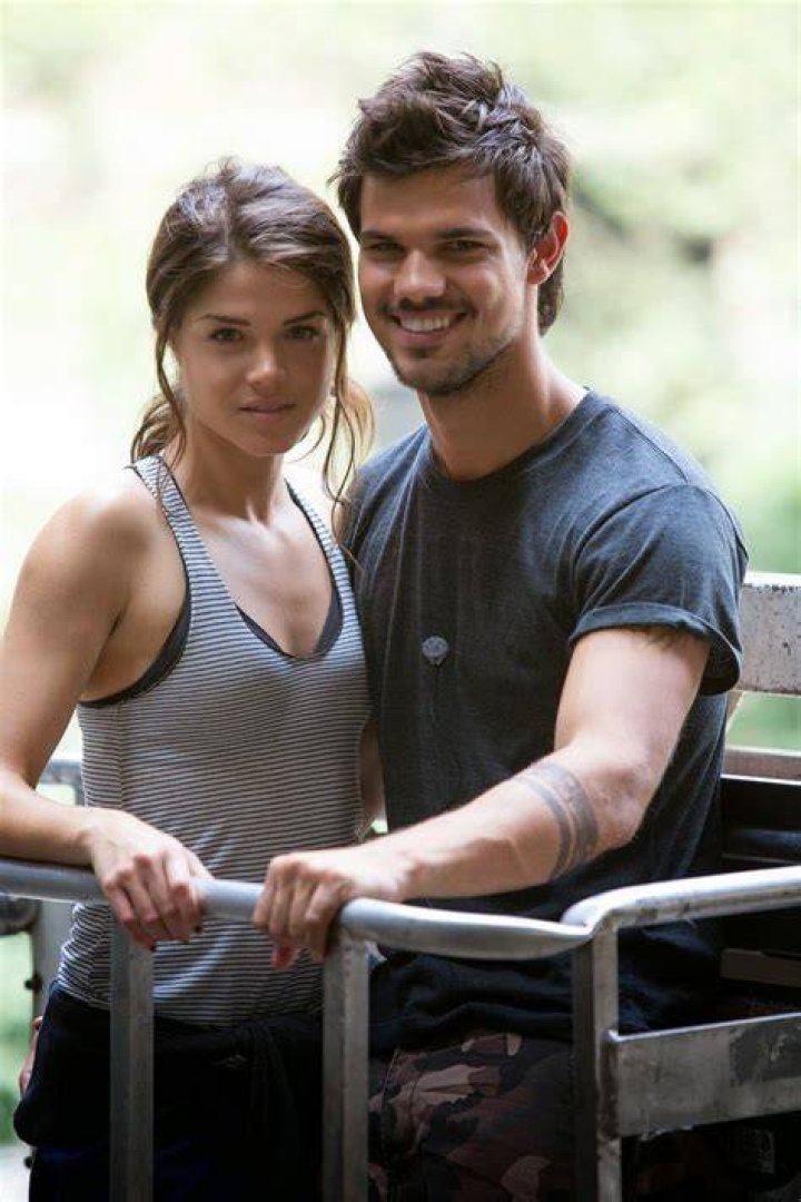 Taylor Lautner and Marie Avgeropoulos are seen on December 9, 2013, in Los Angeles, California. | Source: Getty Images