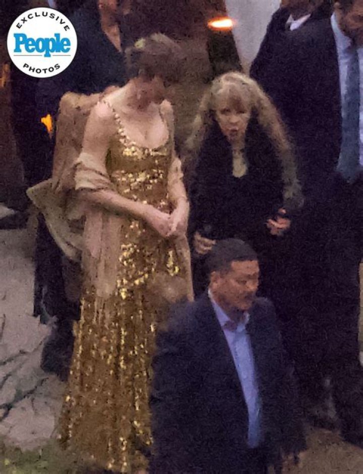 Taylor Swift dazzles in golden flowing dress as she shakes it off as fans show her love in the front rows at her opeing night of her Era tour in Arizona. 18 Mar 2023 Pictured: Taylor Swift. Photo credit: Brian Prahl/MEGA TheMegaAgency.com +1 888 505 6342 (Mega Agency TagID: MEGA958257_001.jpg) [Photo via Mega Agency]