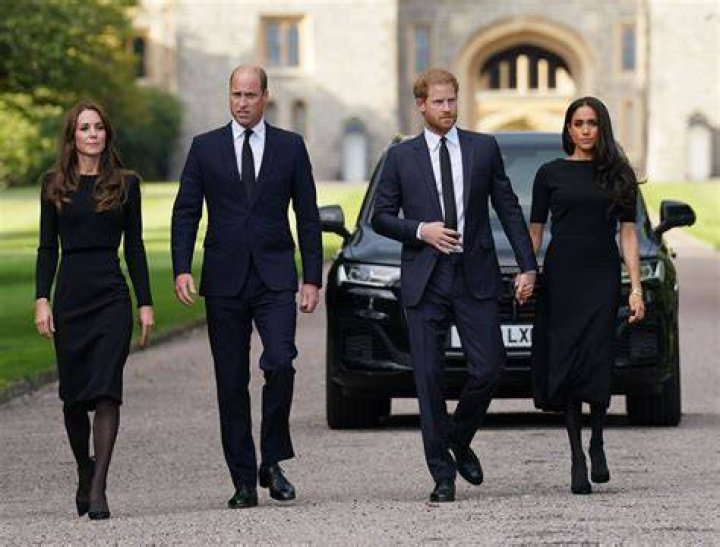 The Duchess of Sussex, who was wearing a cream sleeveless Givenchy dress, would have been barely eight weeks’ pregnant in Prince Charles' 70th birthday photograph (L-R Back row The Duchess of Cambridge holding Prince Louis, Prince William, Prince Harry, Meghan, front row Prince George, Prince Charles, Duchess of Cornwall, Princess Charlotte)