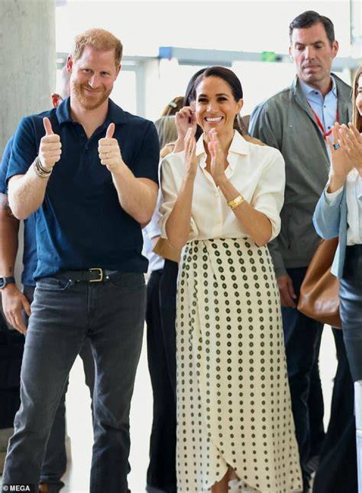 The Duchess of Sussex wowed in a stunning monochrome ensemble as she joined husband Prince Harry at Royal Ascot at the Berkshire racecourse