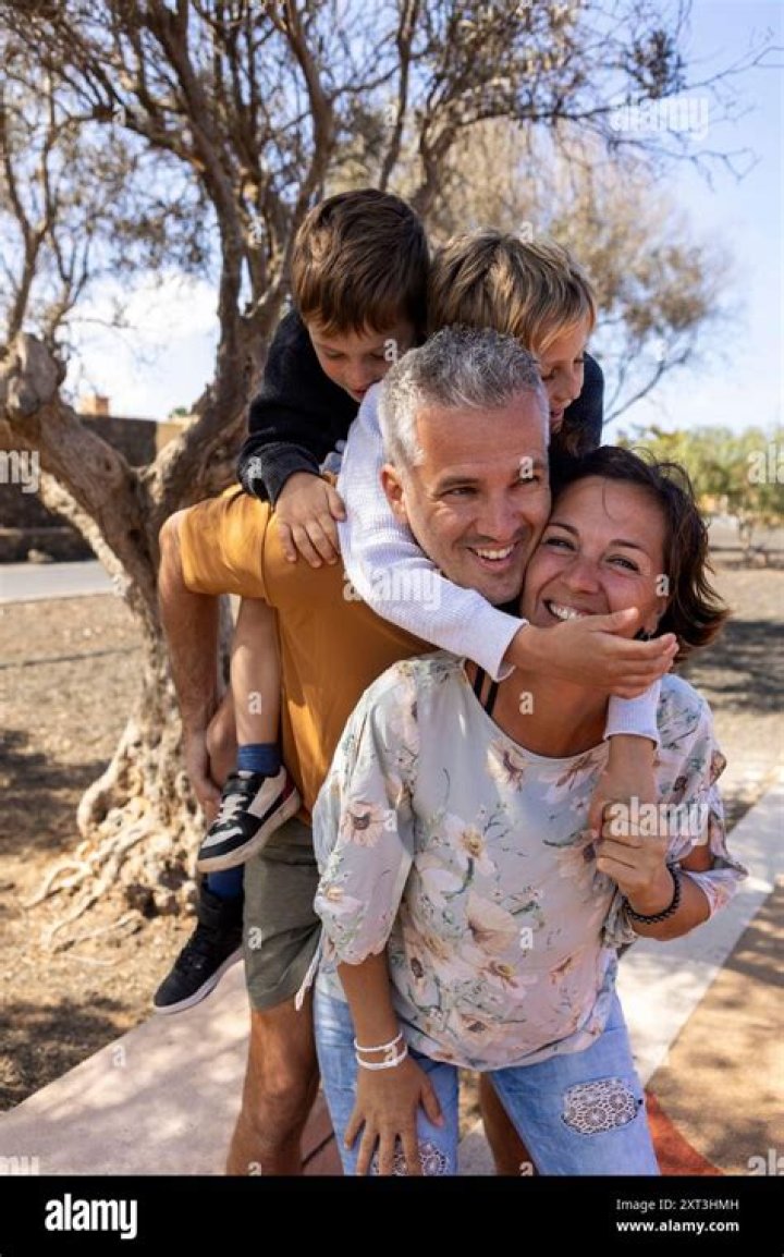 The father-of-two (seen with his wife and their older daughter) has only been working as a photographer since 2016, having previously had a career in finance