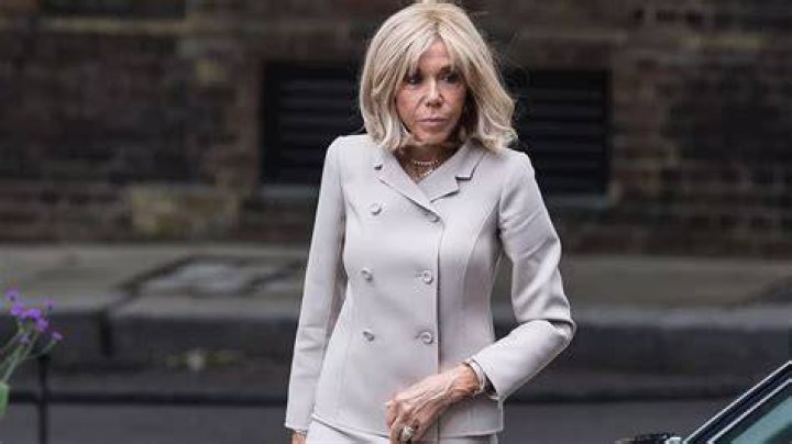 The French First Lady looked a picture of elegance today in a fawn suit as she joined the UK Prime Minister's wife and FLOTUS for a performance at the Minack Theatre while in Cornwall for the G7 summit