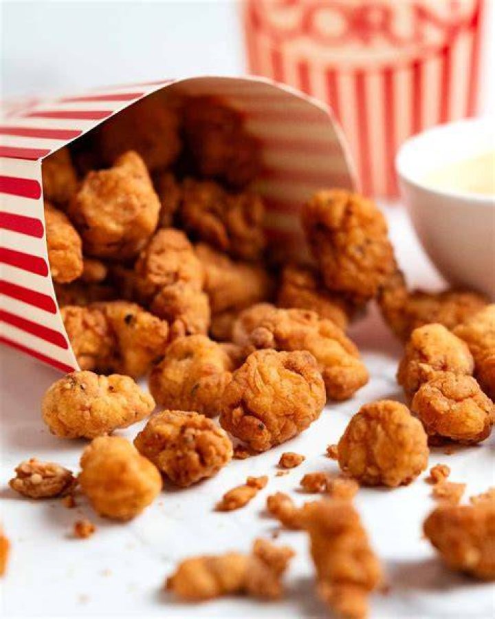 The popcorn chicken is then baked in the oven at 180-degree for 12-15 minutes or until they're golden brown