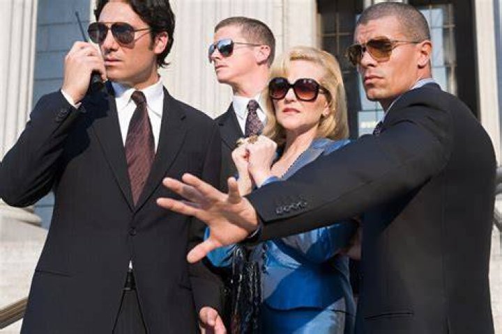 Tough guy! The bodyguards all gave the couple a bit of space as they made their way down the Spanish Steps - but they were never too far away
