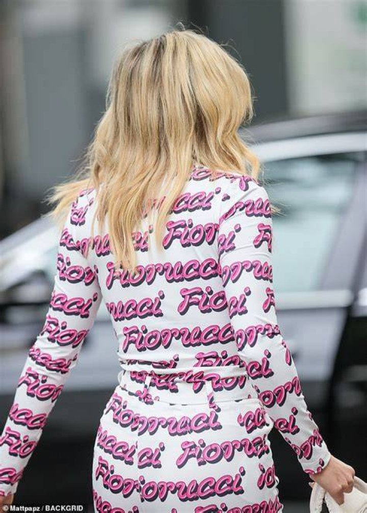 Turning heads: Ashley showed off her style credentials in the he attention-grabbing garment