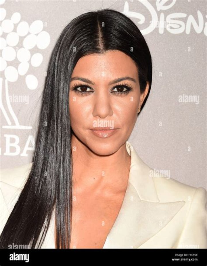 TV Personality Kourtney Kardashian and then-boyfriend Scott Disick attend Women's Health Hosts Hamptons "Party Under The Stars" for RUN10 FEED10 at Bridgehampton Tennis and Surf Club on August 9, 2014 in Bridgehampton, New York | Source: Getty Images