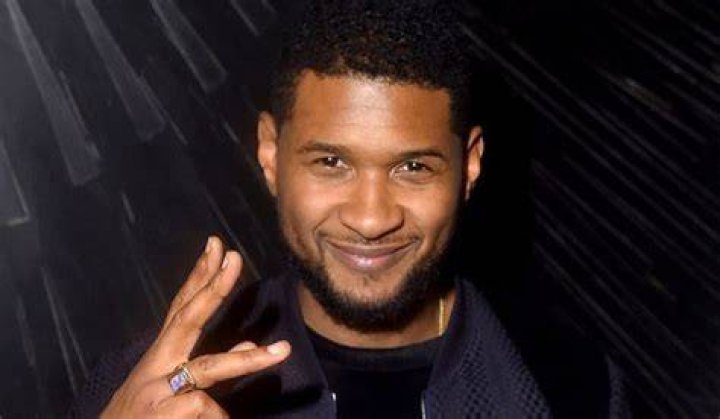 Usher Raymond's mom posing for a photograph | Photo: Instagram/usher