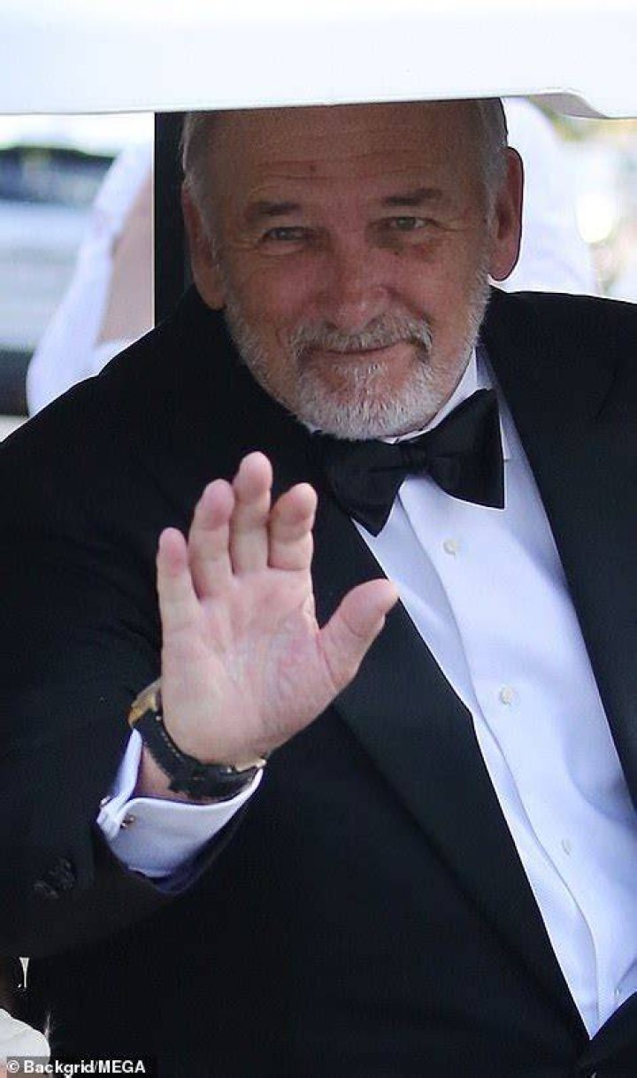 Wave: Ted waved to passersby as he rode across the Peltz estate in a golf buggy