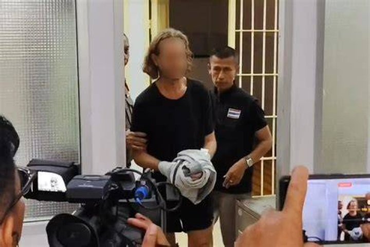 Witnesses reported seeing him dressed in a green shirt with an American flag design