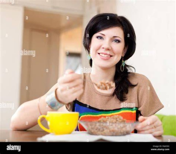 Woman Eats Cereal