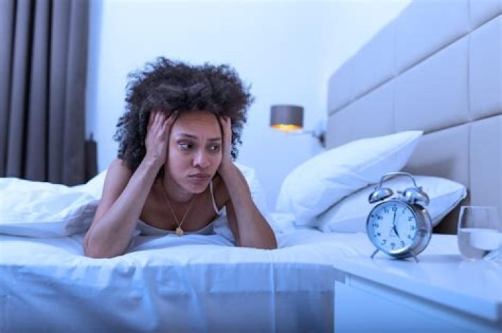 woman not able to sleep in bed